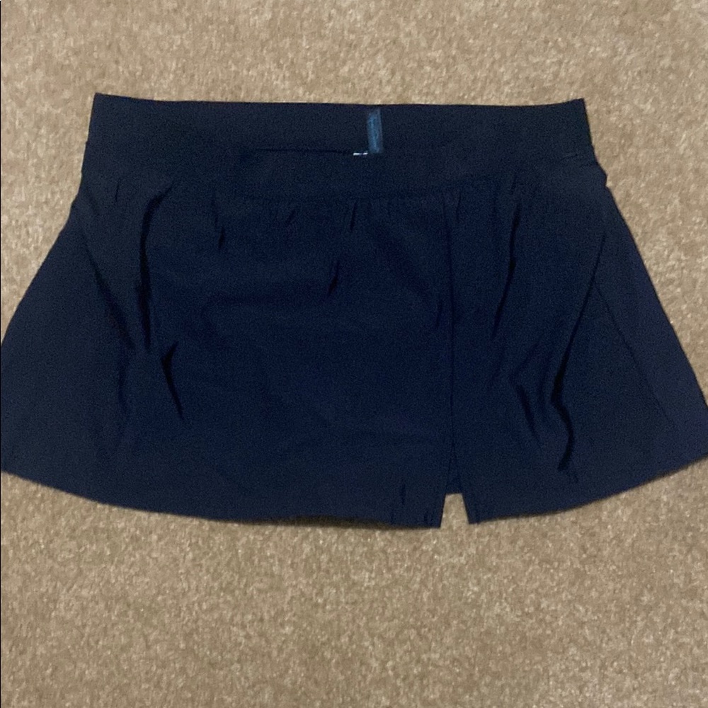 NWOT. Black swimsuit skirt. Size large. Aqua Green brand.